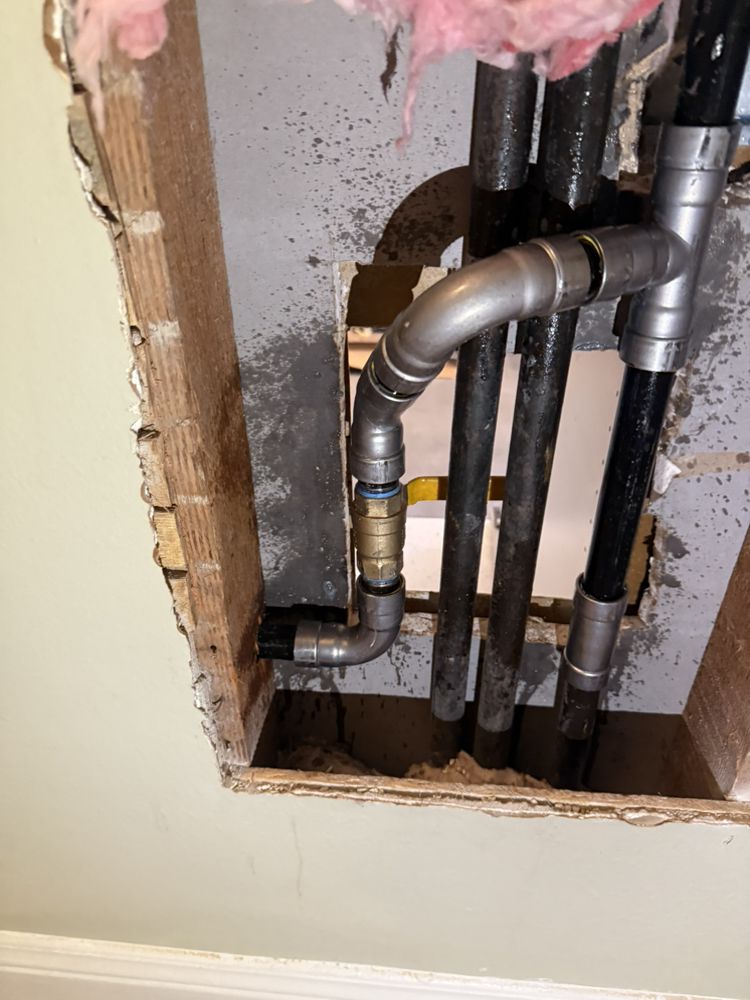 Freshly installed PEX plumbing pipe inside a wall during a Gainesville repipe project